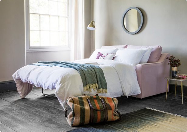 Guest bedroom interior with Lolly 3-Seater Sofa Bed in pink by Perch & Parrow